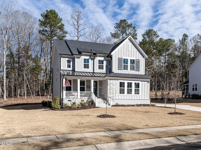 modern inspired farmhouse featuring a porch, a shingled roof, board and batten siding, a standing seam roof, and metal roof