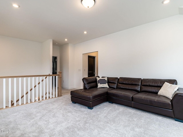 living room featuring light colored carpet and recessed lighting