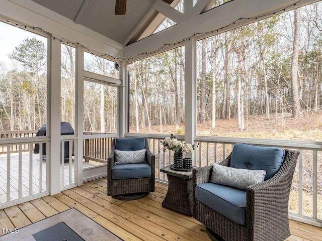 sunroom / solarium with vaulted ceiling and ceiling fan