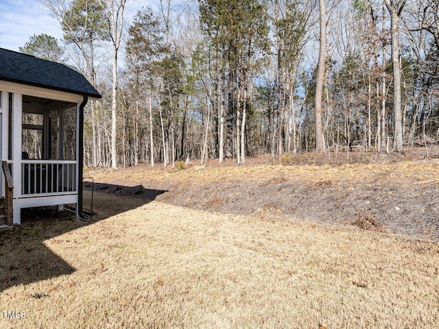 view of yard with a sunroom