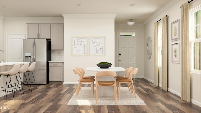 dining room with crown molding and dark hardwood / wood-style floors