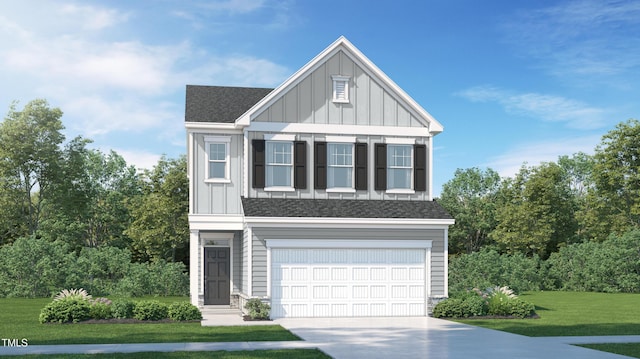 view of front of house with a front yard and a garage