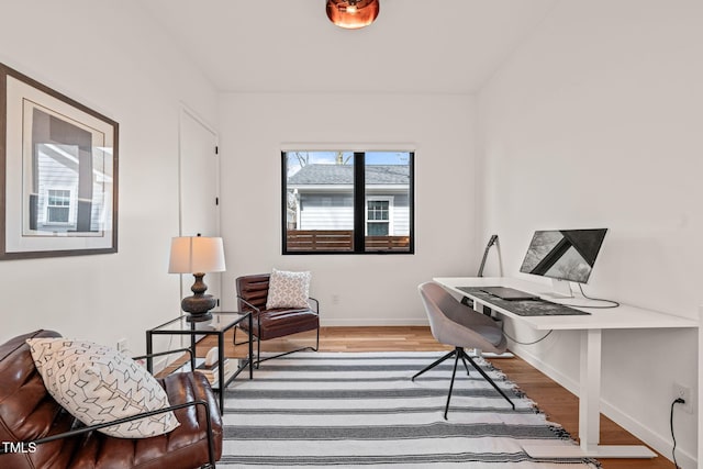 office space featuring wood finished floors and baseboards