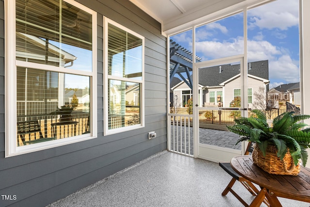 sunroom / solarium featuring a healthy amount of sunlight