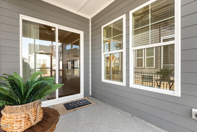 view of exterior entry with covered porch