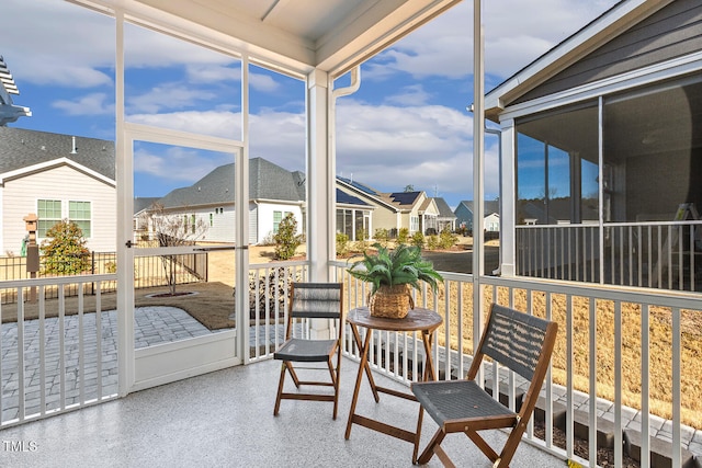 sunroom with a residential view