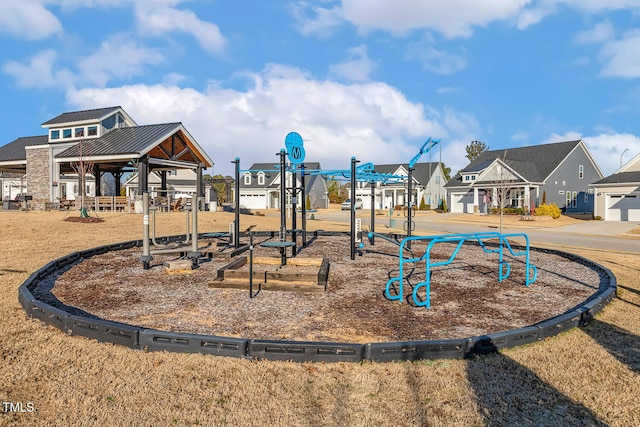 communal playground featuring a residential view