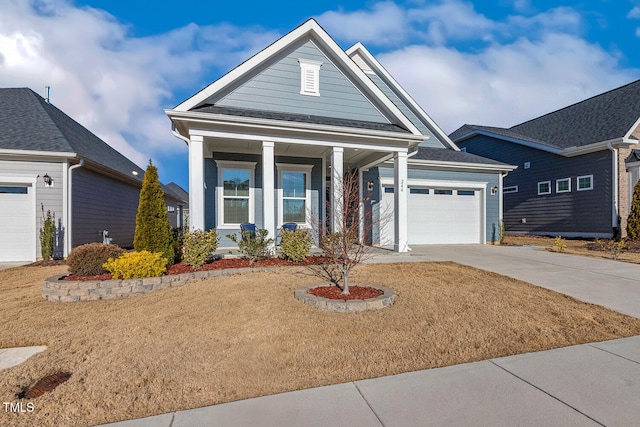 view of front of house featuring a garage and concrete driveway