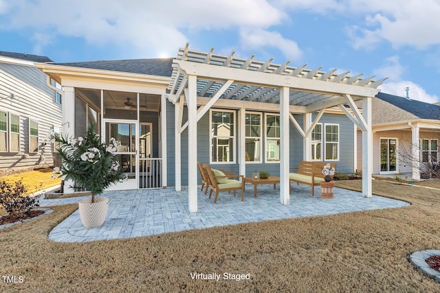 back of house with a sunroom, roof with shingles, a patio, and a pergola