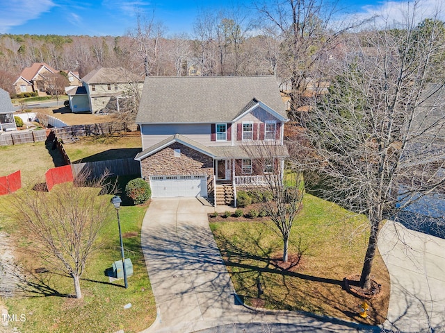 view of front of home with a front yard and a porch