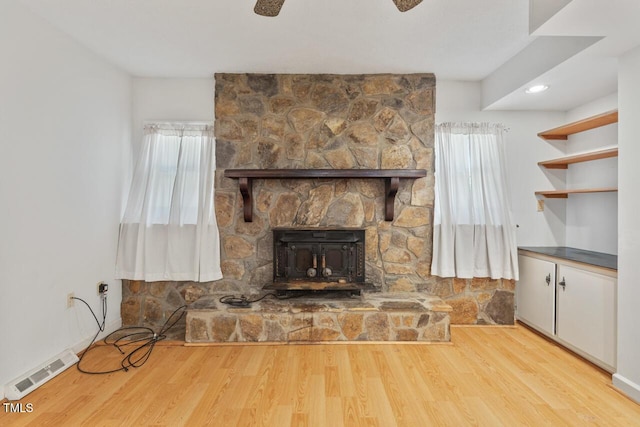 620 Mcghees Mill Rd, Roxboro, NC 27574 - unfurnished living room featuring plenty of natural light, a fireplace, wood finished floors, and visible vents