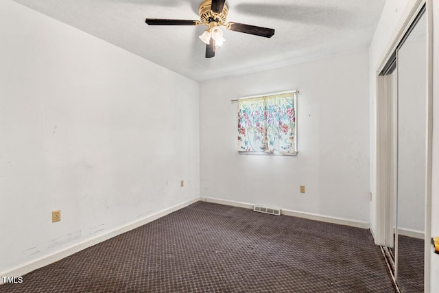 620 Mcghees Mill Rd, Roxboro, NC 27574 - unfurnished bedroom featuring carpet flooring, a textured ceiling, baseboards, visible vents, and a closet