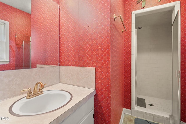 620 Mcghees Mill Rd, Roxboro, NC 27574 - bathroom featuring vanity, a stall shower, and wallpapered walls