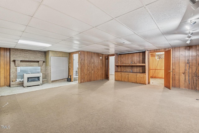 620 Mcghees Mill Rd, Roxboro, NC 27574 - finished basement with a fireplace, wood walls, and a paneled ceiling