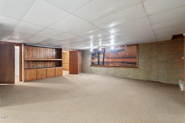 620 Mcghees Mill Rd, Roxboro, NC 27574 - finished basement featuring a paneled ceiling, brick wall, and light carpet