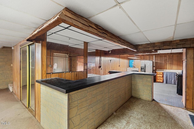 620 Mcghees Mill Rd, Roxboro, NC 27574 - interior space with wood walls and refrigerator with ice dispenser