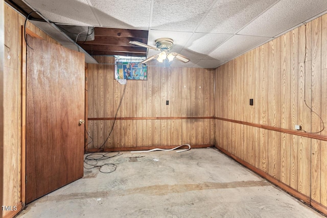 620 Mcghees Mill Rd, Roxboro, NC 27574 - finished below grade area featuring baseboards, a paneled ceiling, ceiling fan, and wooden walls