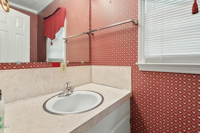 620 Mcghees Mill Rd, Roxboro, NC 27574 - bathroom with wallpapered walls and vanity