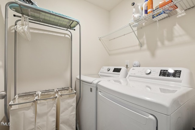 laundry area with washing machine and dryer and laundry area