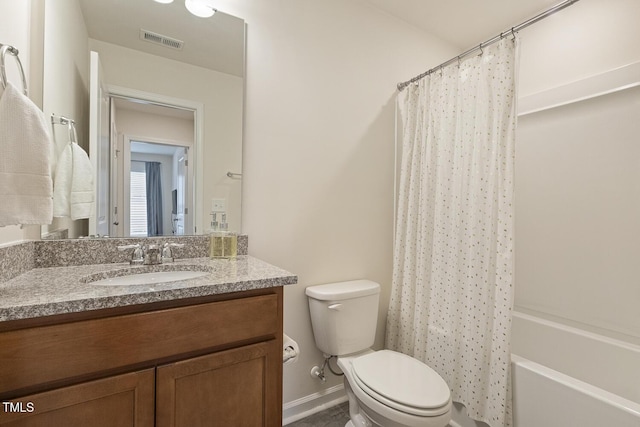 bathroom featuring visible vents, toilet, shower / bath combo with shower curtain, vanity, and baseboards