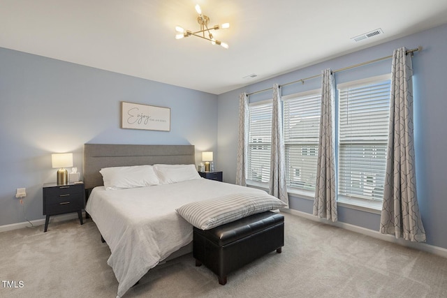 bedroom with carpet, visible vents, and baseboards