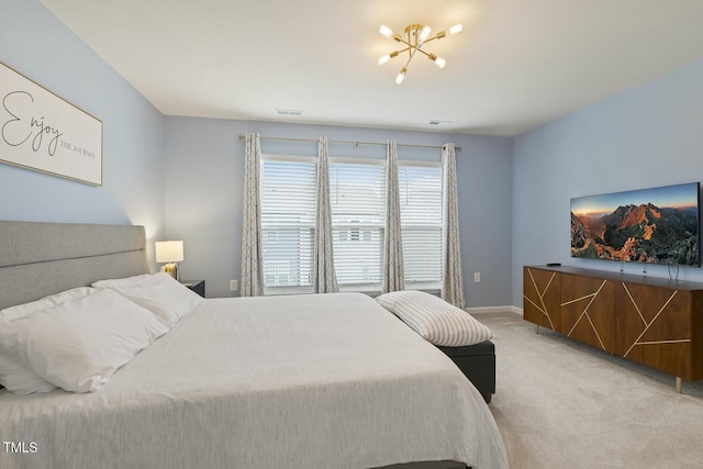 bedroom featuring baseboards, visible vents, a chandelier, and light colored carpet