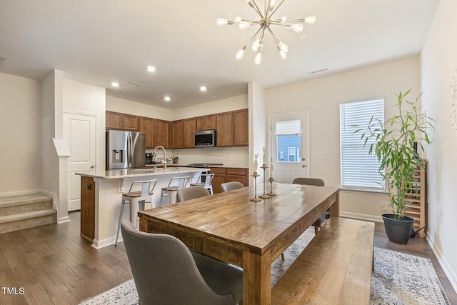 dining area featuring dark wood finished floors, recessed lighting, visible vents, stairway, and baseboards