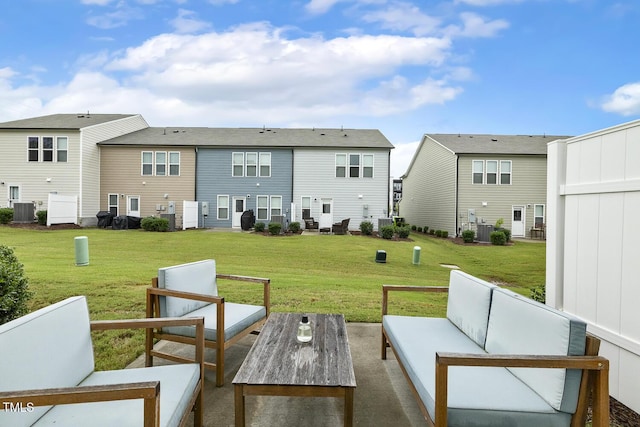 exterior space with central air condition unit, an outdoor living space, and a yard