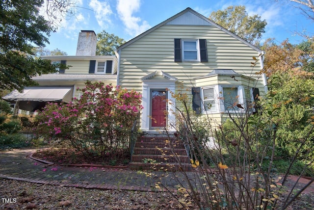 view of front of house with a chimney