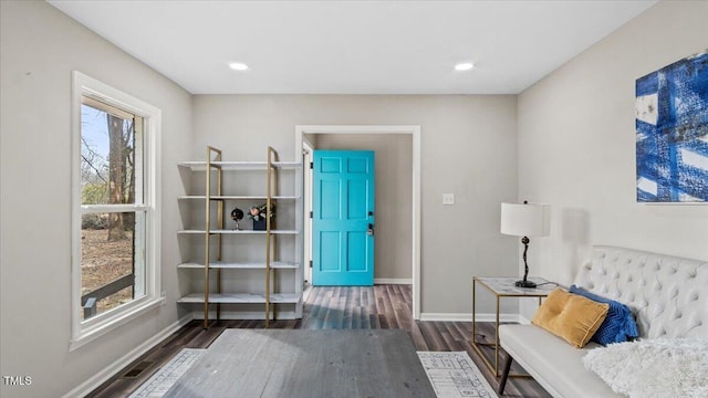 living area with recessed lighting, dark wood finished floors, and baseboards