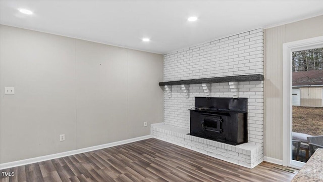 unfurnished living room featuring dark wood-style floors, recessed lighting, visible vents, and baseboards