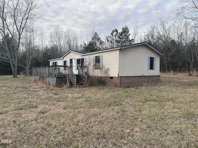 view of front of property with crawl space, stairs, a deck, and a front yard