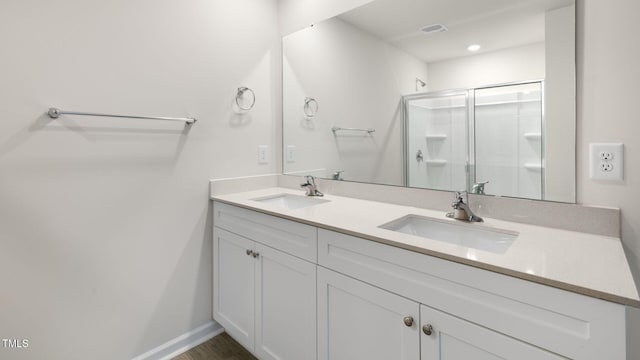 bathroom featuring vanity and walk in shower