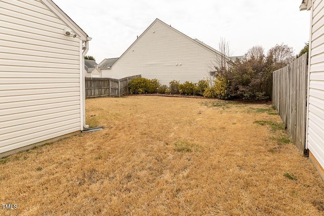 view of yard with a fenced backyard