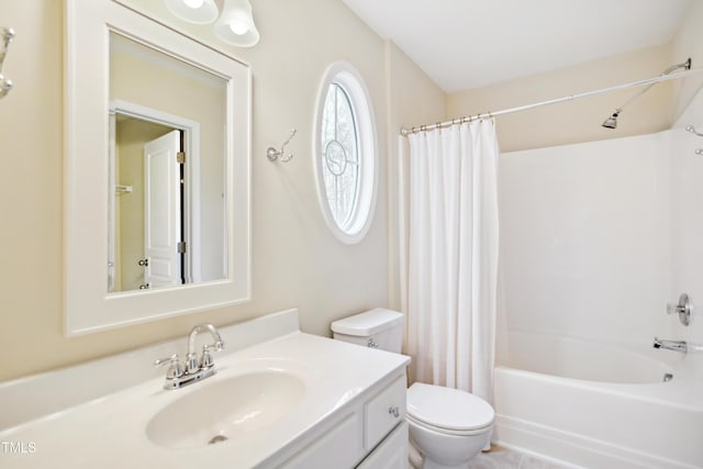 bathroom featuring toilet, shower / tub combo with curtain, and vanity