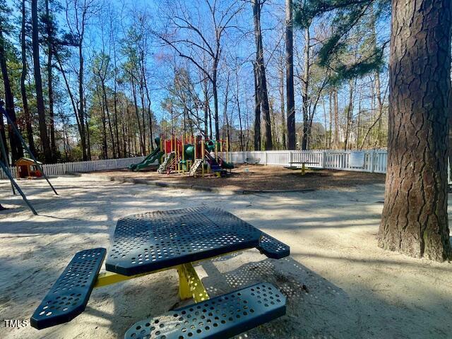 communal playground featuring fence