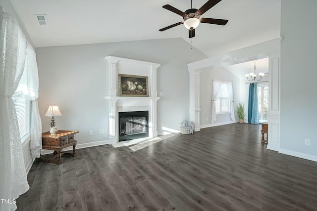 unfurnished living room with lofted ceiling, dark wood-style floors, a fireplace with flush hearth, and baseboards