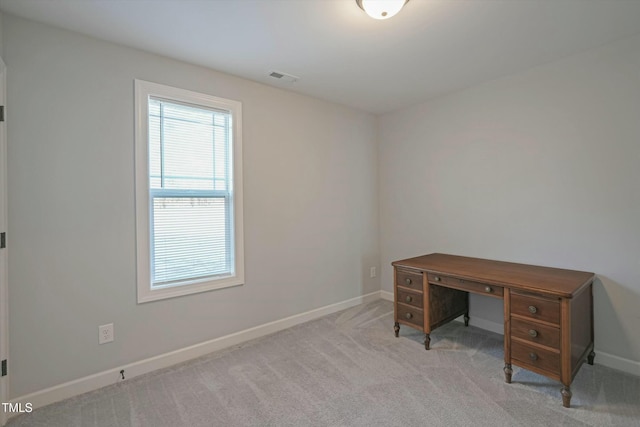 office area featuring visible vents, light carpet, and baseboards