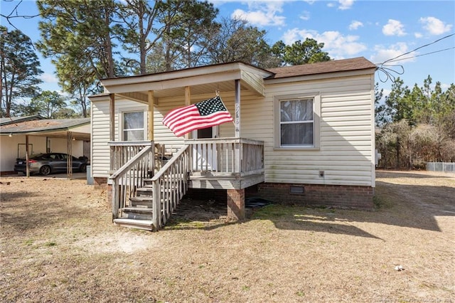 view of front facade featuring a carport