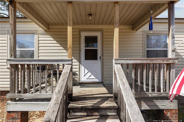 property entrance with covered porch