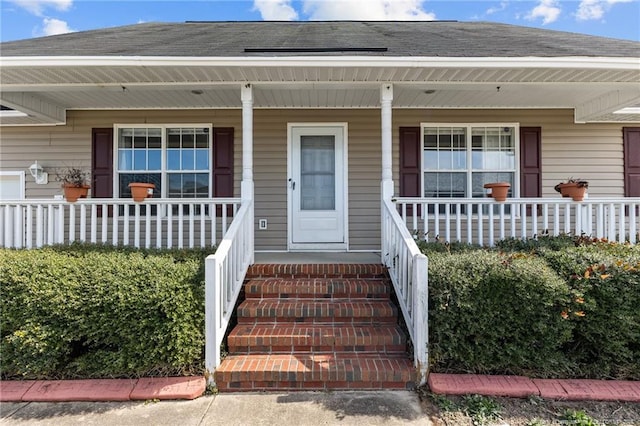 property entrance with covered porch