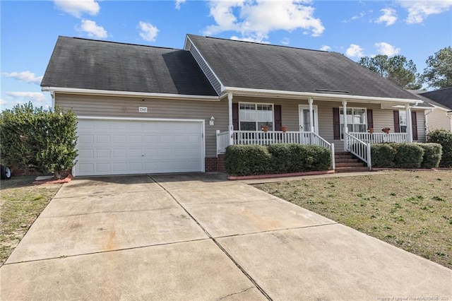 ranch-style home with a front lawn, covered porch, driveway, and a garage