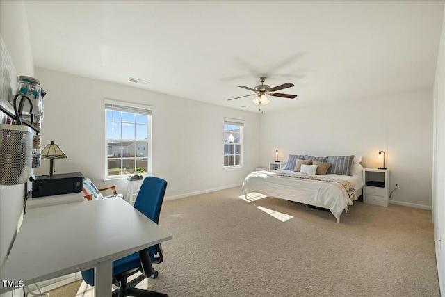 bedroom with light carpet and ceiling fan