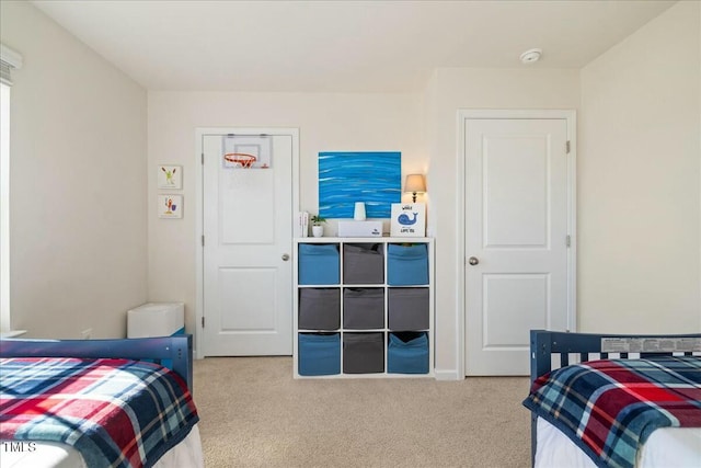 bedroom with light colored carpet