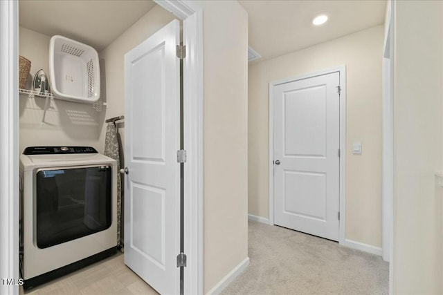 interior space with light colored carpet and washer / dryer