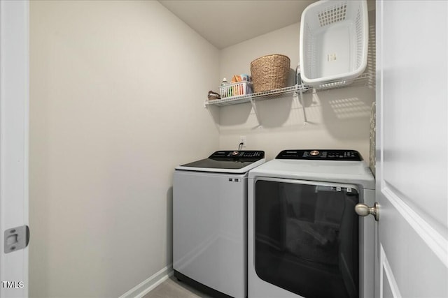 laundry room with separate washer and dryer