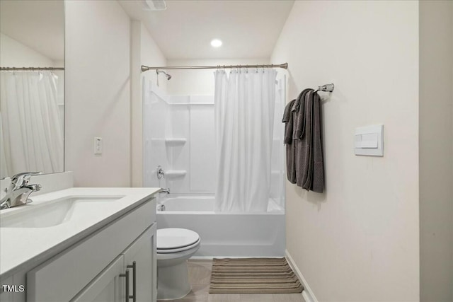 full bathroom featuring toilet, vanity, and shower / bath combination with curtain