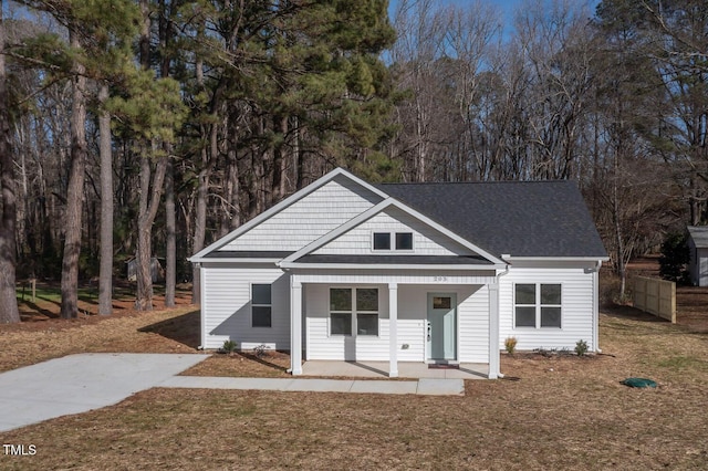 view of front of home featuring a front lawn and a porch