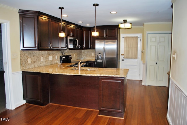 kitchen featuring kitchen peninsula, stainless steel appliances, decorative light fixtures, light stone countertops, and dark hardwood / wood-style floors