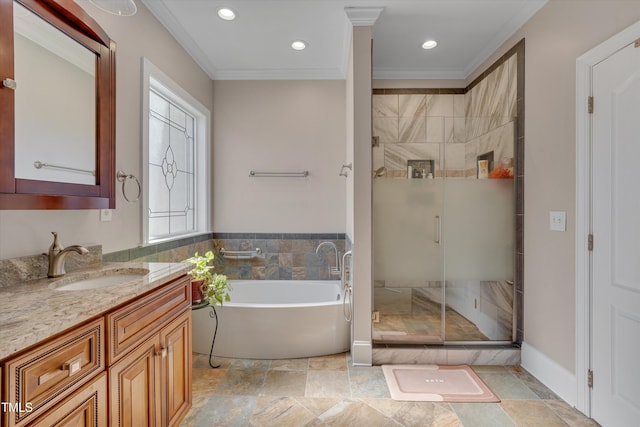 full bath featuring crown molding, a freestanding tub, vanity, and a shower stall